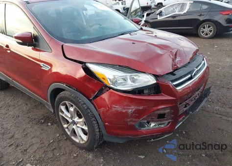 2015 Ford Escape Titanium z USA, uszkodzony, nr VIN 1FMCU9J92FUC72288